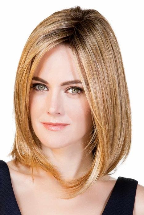 Woman in a 14" warm blonde straight hair topper blended with her hair