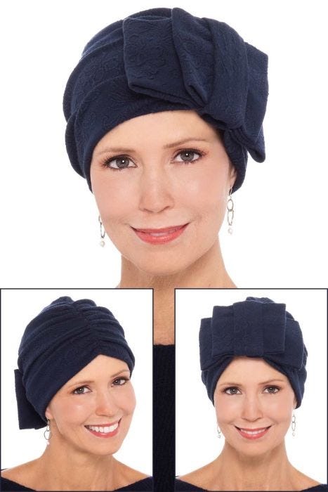Woman in navy blue cloche style chemo hat with textured fabric
