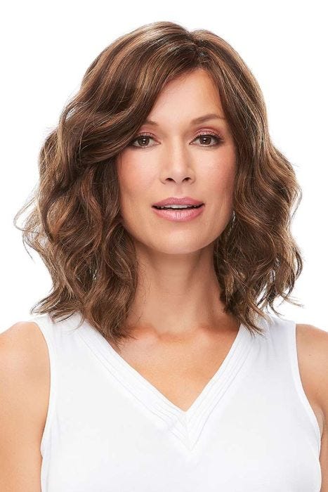 Woman in a petite shoulder length medium brown wavy lace front wig