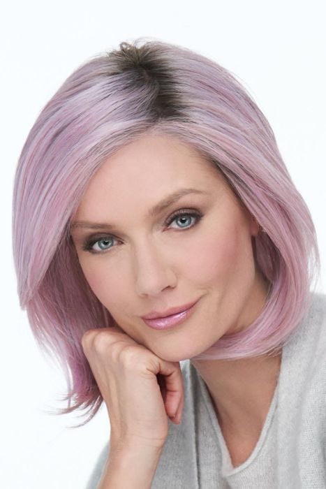 Woman in a shoulder length pastel pink lace front bob wig