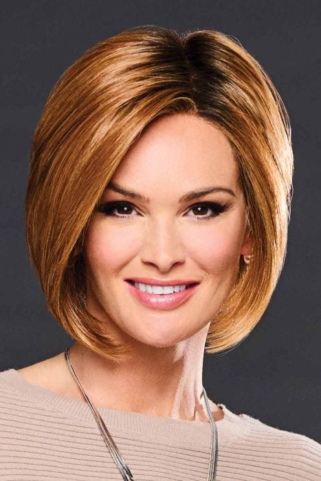 Woman in a past the chin medium auburn angled lace front bob wig