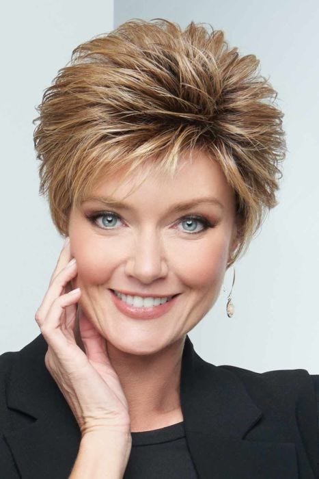 Woman in a blown out light blonde lace front pixie wig with longer hair on top