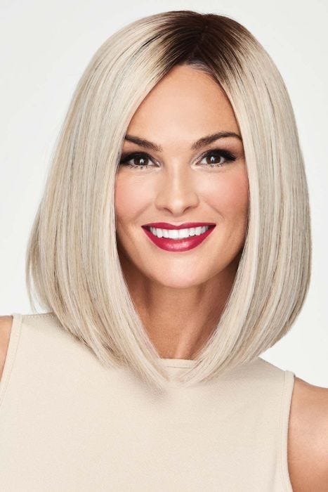Woman in a shoulder length platinum blonde blunt lace front wig