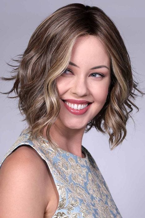 Woman in short wavy bob wig by Bell Tress in dirty blonde