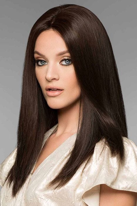Woman in a petite extra long dark brown straight remy human hair wig