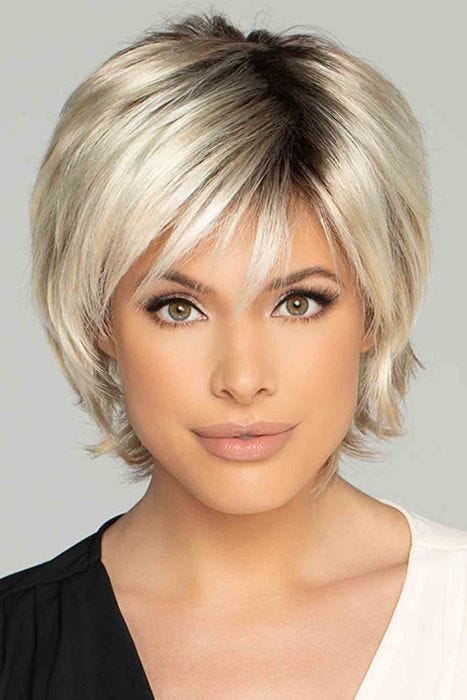 Woman in a short shaggy platinum bob lace front wig with wispy bangs