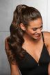 Woman in a 23" dark brown clip on curly ponytail attached to her hair