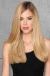 woman in 20" reddish blonde hair extensions attached to her hair
