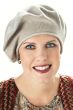 Woman in sand colored cotton beret