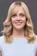 Woman in an extra large 12" blonde human hair topper for thinning hair