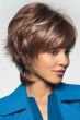 Woman in brown short to shoulder length bi level style wig with highlights, layers and bangs