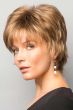 Woman in a shaggy layered short red blonde wig with wispy bangs