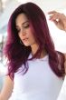 Woman in an extra long burgundy layered wig