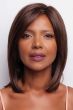 Black woman in a shoulder length straight dark auburn lace front wig with side bangs
