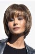 Woman in a past the chin feathered ash brown bob wig with shaggy bangs