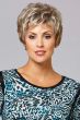 Woman in a long layered light blonde pixie wig with wispy bangs