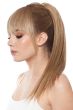 Woman in an 18.5" warm blonde human hair ponytail hair clip