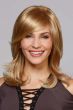 Woman in a shoulder length dark blonde long layered bob wig with side bangs