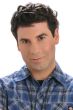 Man in a short dark brown human hair men's topper for thinning hair