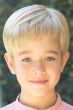 Little boy in a cropped light blonde short lace front children's wig