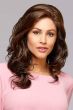 Woman in a past the shoulders curly dark brown wig with a lace front