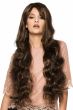 Woman in a large 32" wavy dark brown full wig