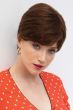 Woman in a long medium auburn classic human hair pixie wig