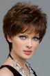 Woman in a medium brown pixie wig with longer hair on the top and sides
