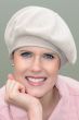 Woman in sand colored beret