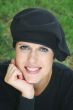 Woman outdoors in black beret hat