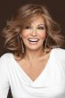 Raquel Welch in a just past the shoulders medium auburn long layered wig with long side swept bangs