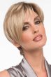 Woman in an asymmetric short blonde pixie wig with textured bangs