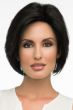 Woman in chin length black blunt bob wig with layering along the face