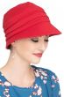 Woman in red brimmed UPF cotton hat for cancer patients