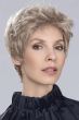 Woman in glasses in a tousled blonde lace front pixie wig with dark roots
