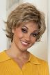 Woman in a wavy textured light brown pixie wig with longer piecey layers on top