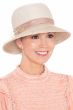 Woman in delicate summer brimmed bucket hat with ribbon woven accents for cancer patients