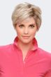 Woman in a light ash blonde asymmetrical pixie wig with long layers