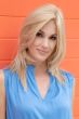 Woman in an extra long dark blonde v-cut lace front wig