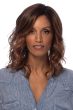 Woman in a shoulder length platinum blonde lace front wig with beach waves and dark roots