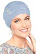 Woman in light blue bamboo sleeping hat for women with cancer