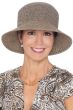 Woman in black and beige summer bucket hat made of straw tweed for cancer patients