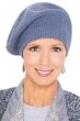 Woman in textured seed stitch winter beret hat for cancer patients
