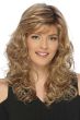 Woman in a past the shoulders curly blonde hair with side bangs