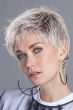 Woman in a short tousled platinum blonde lace front pixie wig