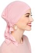 Woman in pink pre tied head scarf headcovering for women with cancer