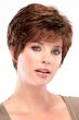 Woman in a petite classic medium auburn pixie wig with side bangs