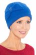 Woman in cute blue wool winter beanie hat with bow and rhinestone decoration