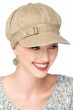 Woman in khaki chemo headwear featuring a newsboy style cap with side buckle