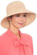 Woman in fine quality packable raffia beach or vacation sun hat for cancer patients